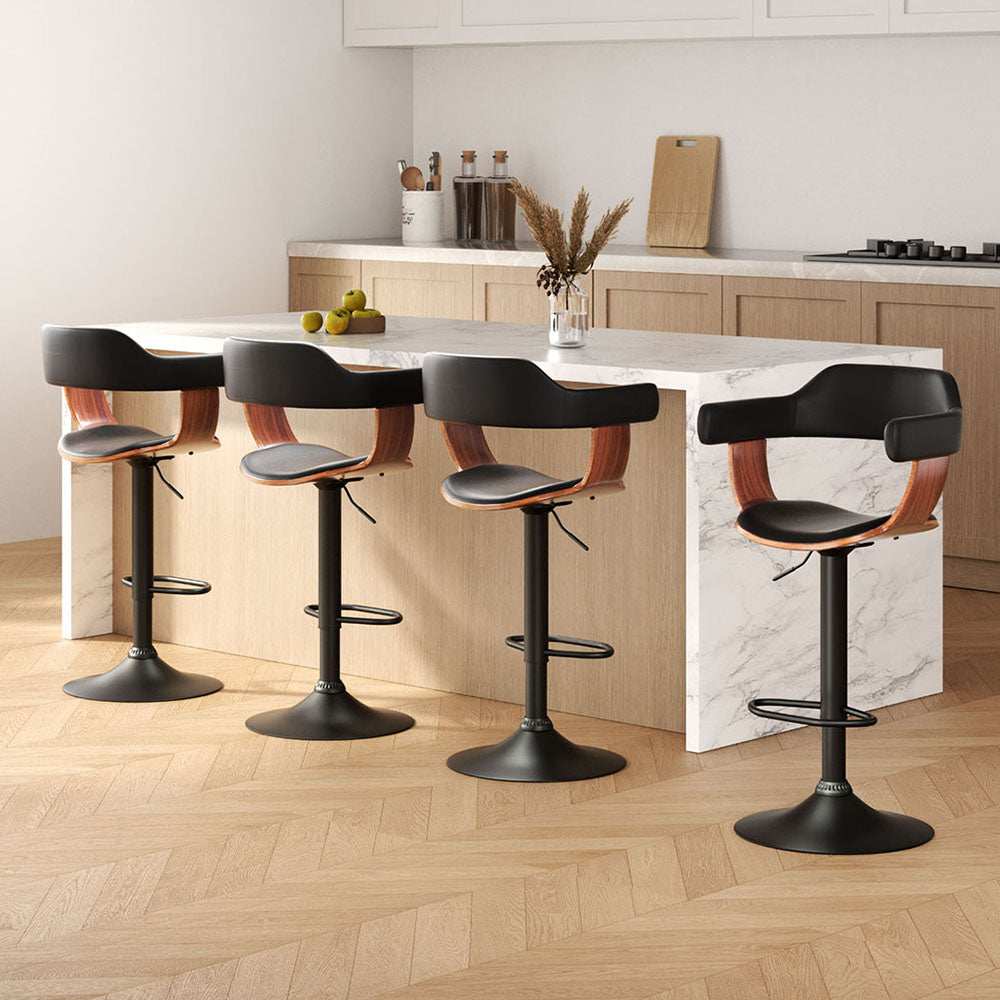 Artiss 4x Bar Stools in black with wooden seat structure and chrome gas lift in modern kitchen setting.