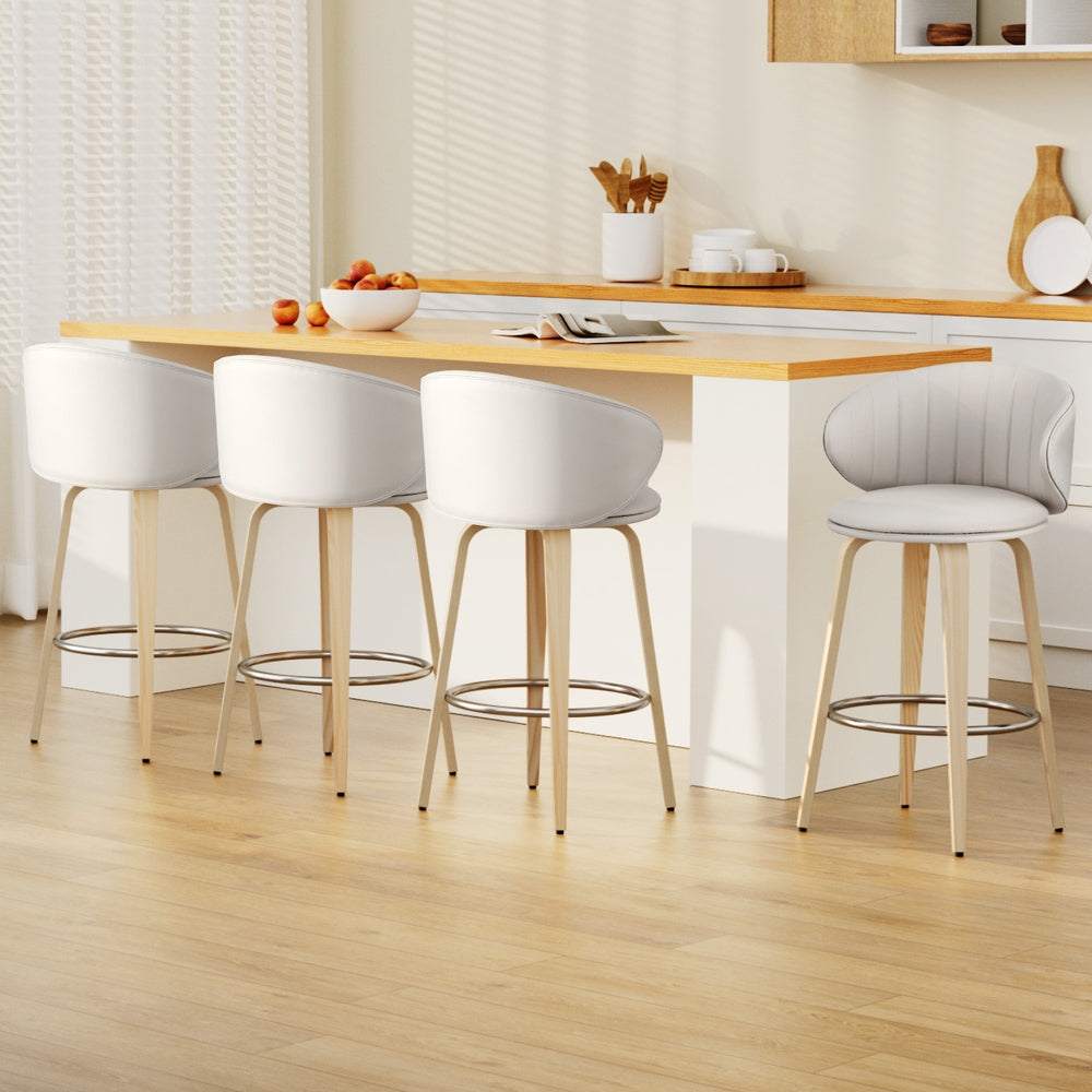 Artiss Bar Stools set of 4 in beige with contoured leather seats and wood legs at a dining island.