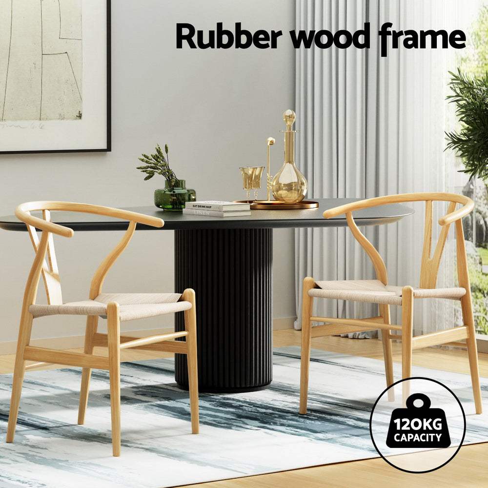 Set of 4 Artiss Wishbone Dining Chairs with rubberwood frame and rattan seat in a stylish dining room.