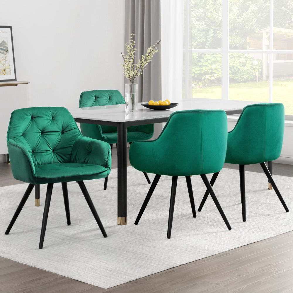 Set of 4 Artiss green velvet dining chairs with diamond tufting and armrests around a dining table.