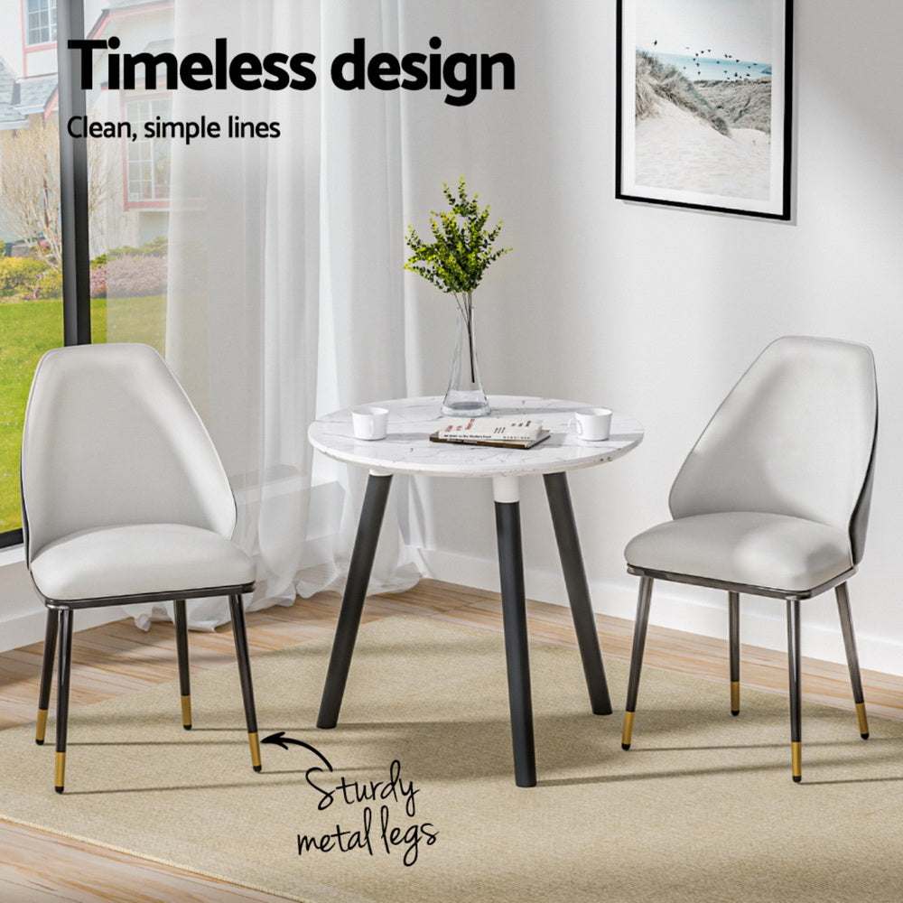 Artiss Dining Chairs Set of 4 with Beige and Black Leather Seats in Modern Dining Room Setting.