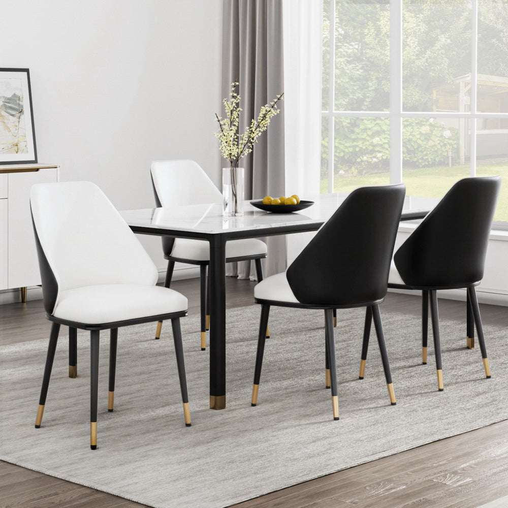 Set of four Artiss dining chairs with beige and black PU leather seats, steel legs, and contoured backrests in a modern dining room.