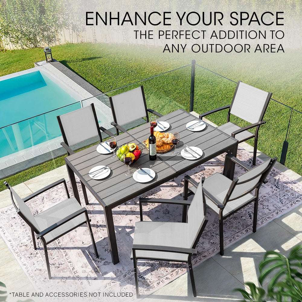Outdoor dining area with Fortia 6-Piece dining chair set by a pool.