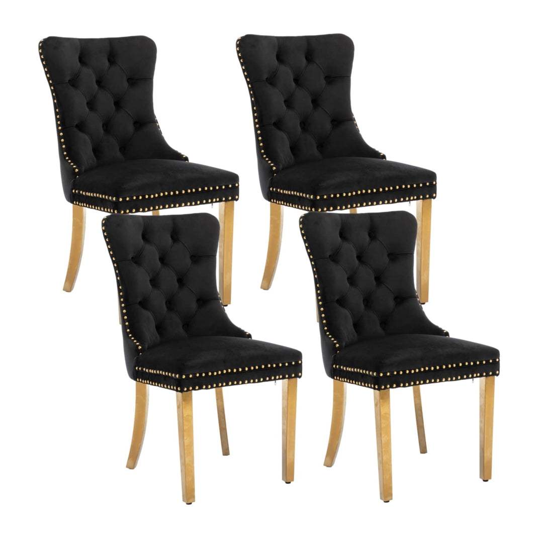 4x black velvet dining chairs with golden metal legs featuring button-tufted backrest and decorative studs.
