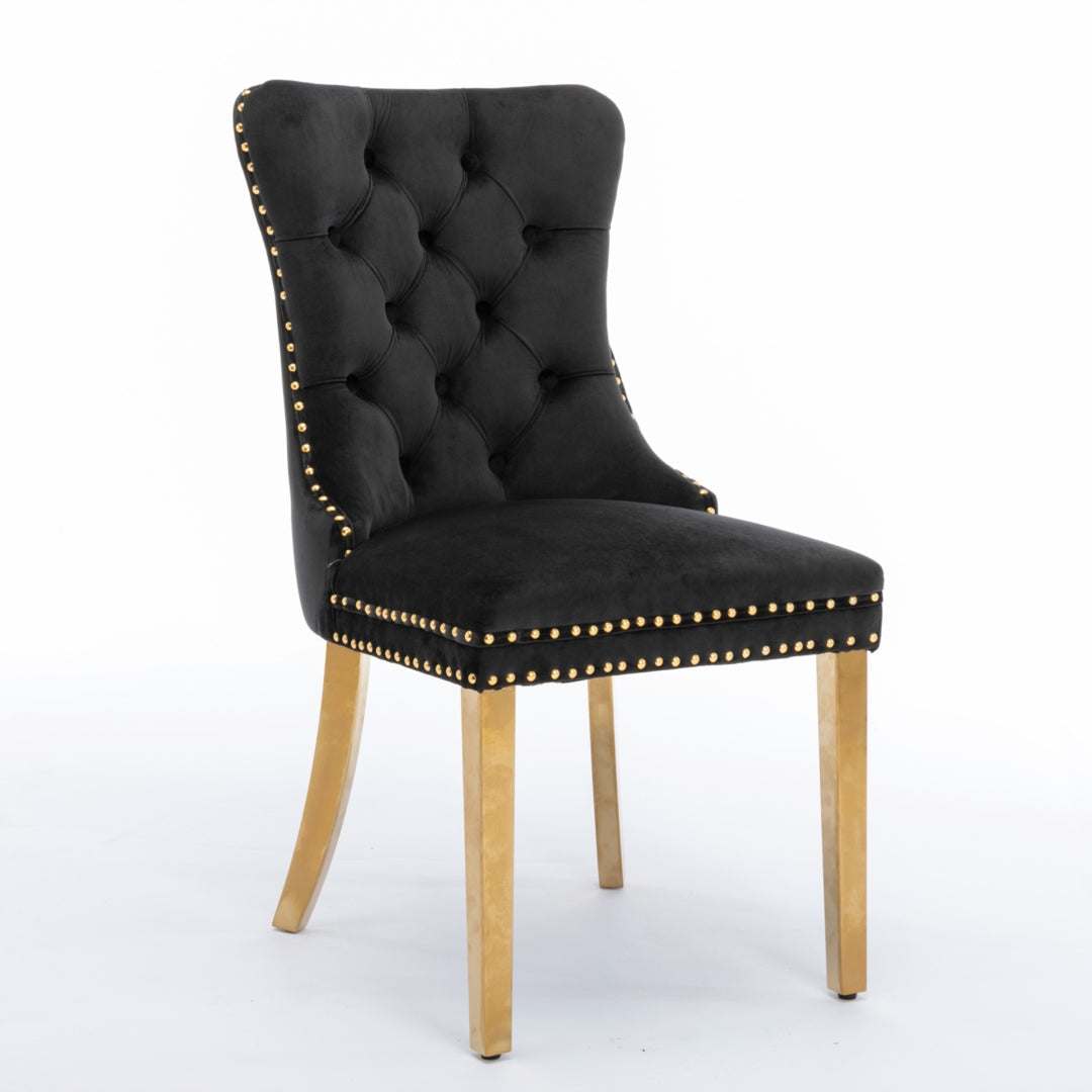 Black velvet dining chair with gold metal legs and button-tufted back.