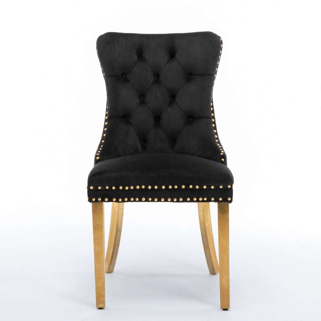 Black velvet dining chair with golden metal legs, button-tufted back, decorative studs, and retro style.