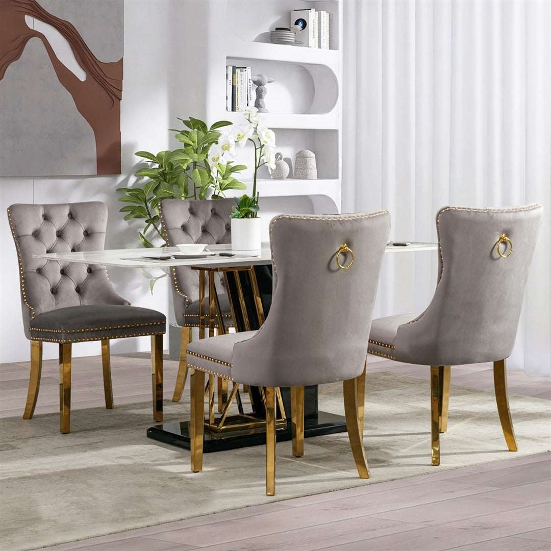 Velvet dining chairs with golden metal legs in a modern dining room setting.