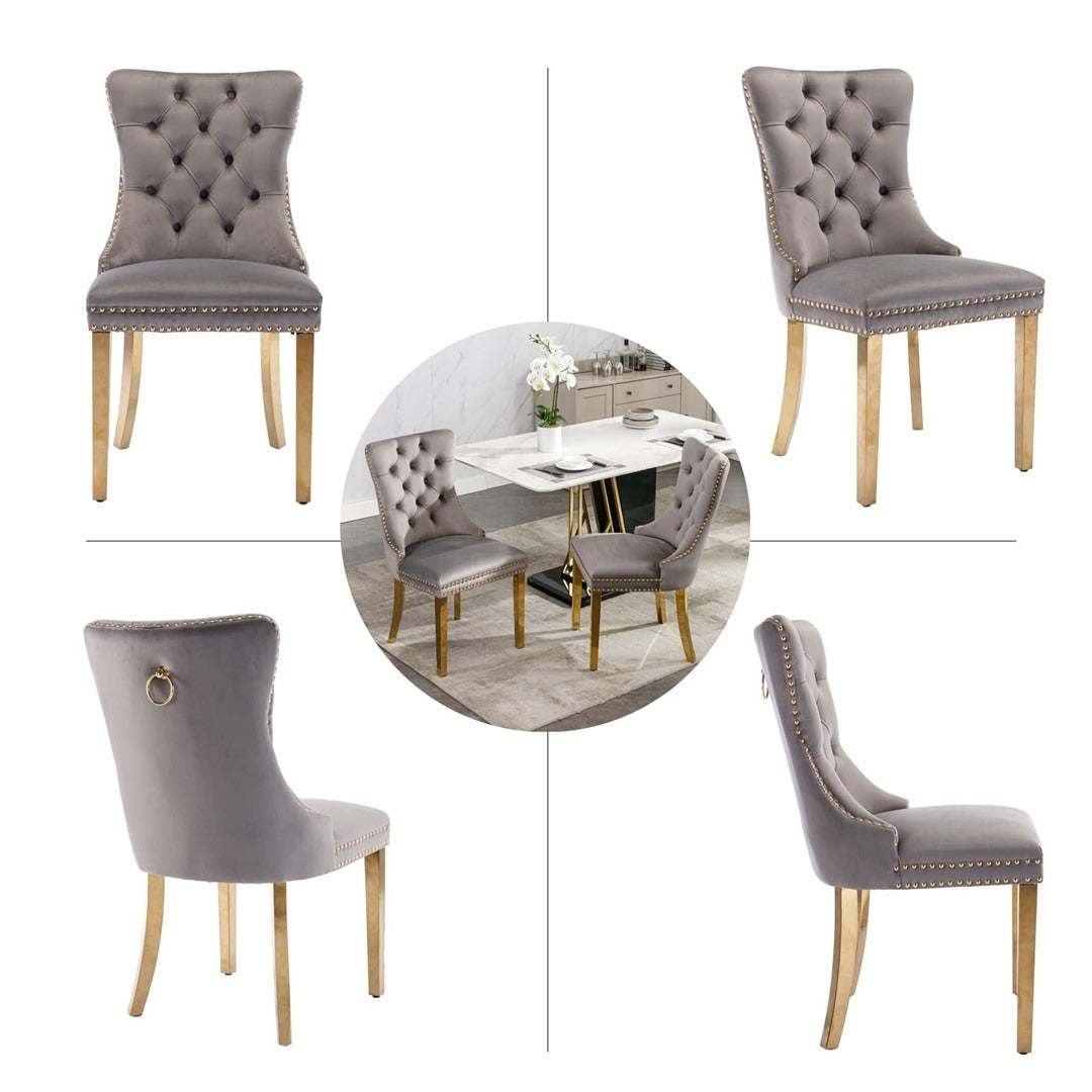 Velvet dining chairs with grey upholstery and golden metal legs, featuring button-tufted design and ring pull-back.