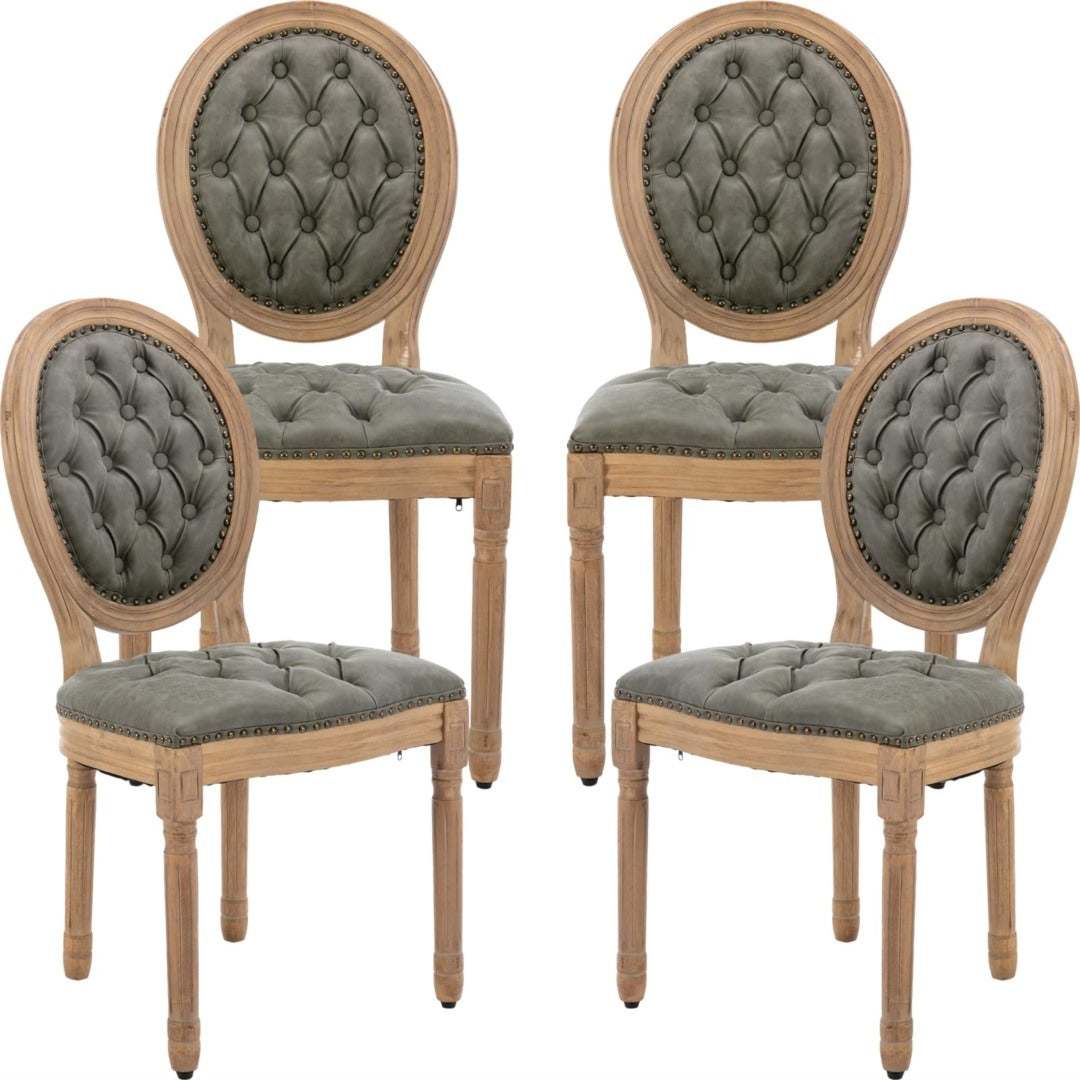 Velvet faux leather dining chairs with solid wood legs in pine green, featuring hand-tufted design and nailhead trim.