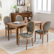 Velvet faux leather dining chairs with solid wood legs in pine green, featuring hand-tufted decor and nailhead trim.