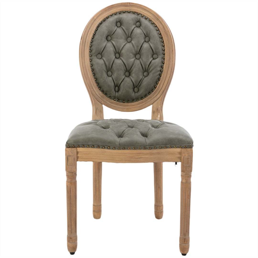 Velvet faux leather dining chair with solid wood legs in pine green, featuring tufted decor and nailhead trim.