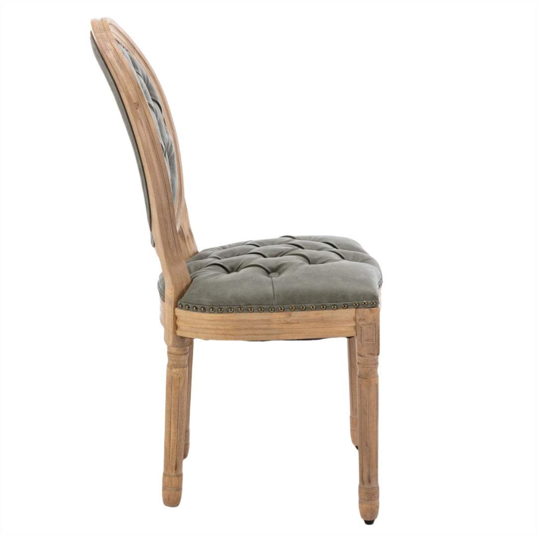 Velvet faux leather dining chair with pine green upholstery, hand-tufted decor, and solid wood legs.