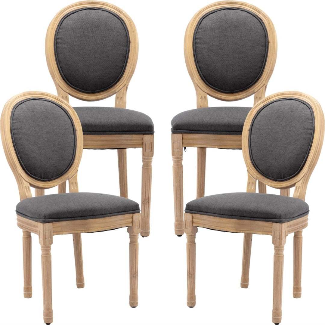 4x grey linen dining chairs with carved wood legs and round backrests.