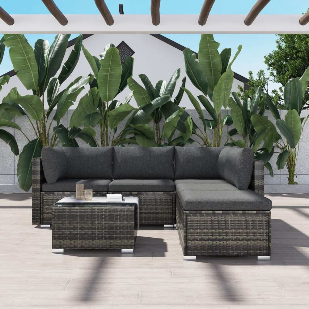 Ottoman-Style Outdoor Lounge Set in Grey with PE rattan wicker, glass-top table, and cushioned seats on a patio setting.