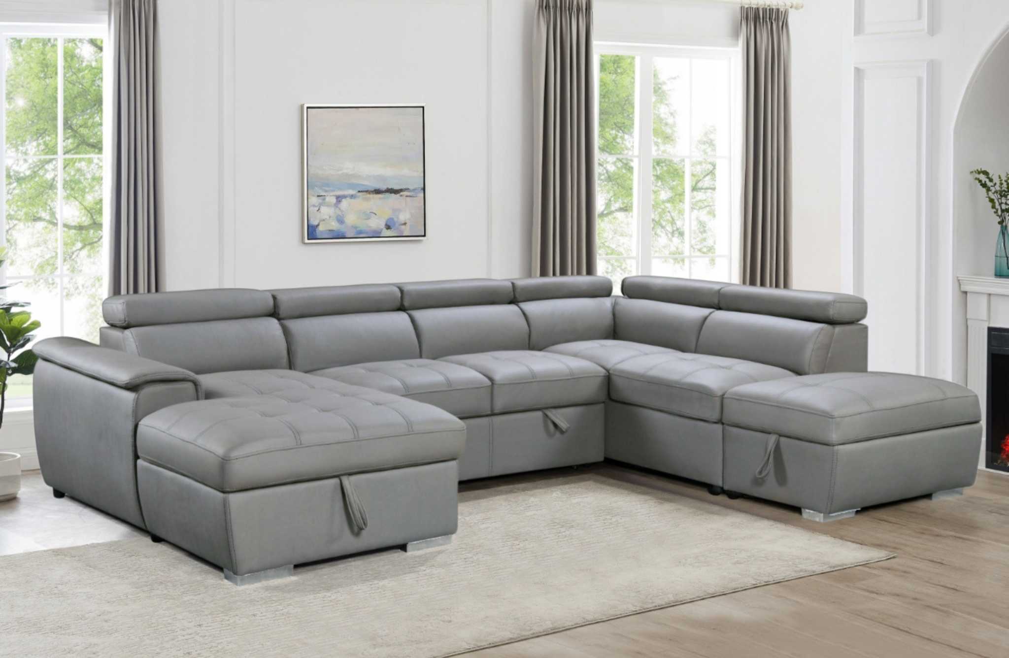 Light grey plush sleeper modular chaise lounge with adjustable headrests and ottoman storage, in a modern living room.