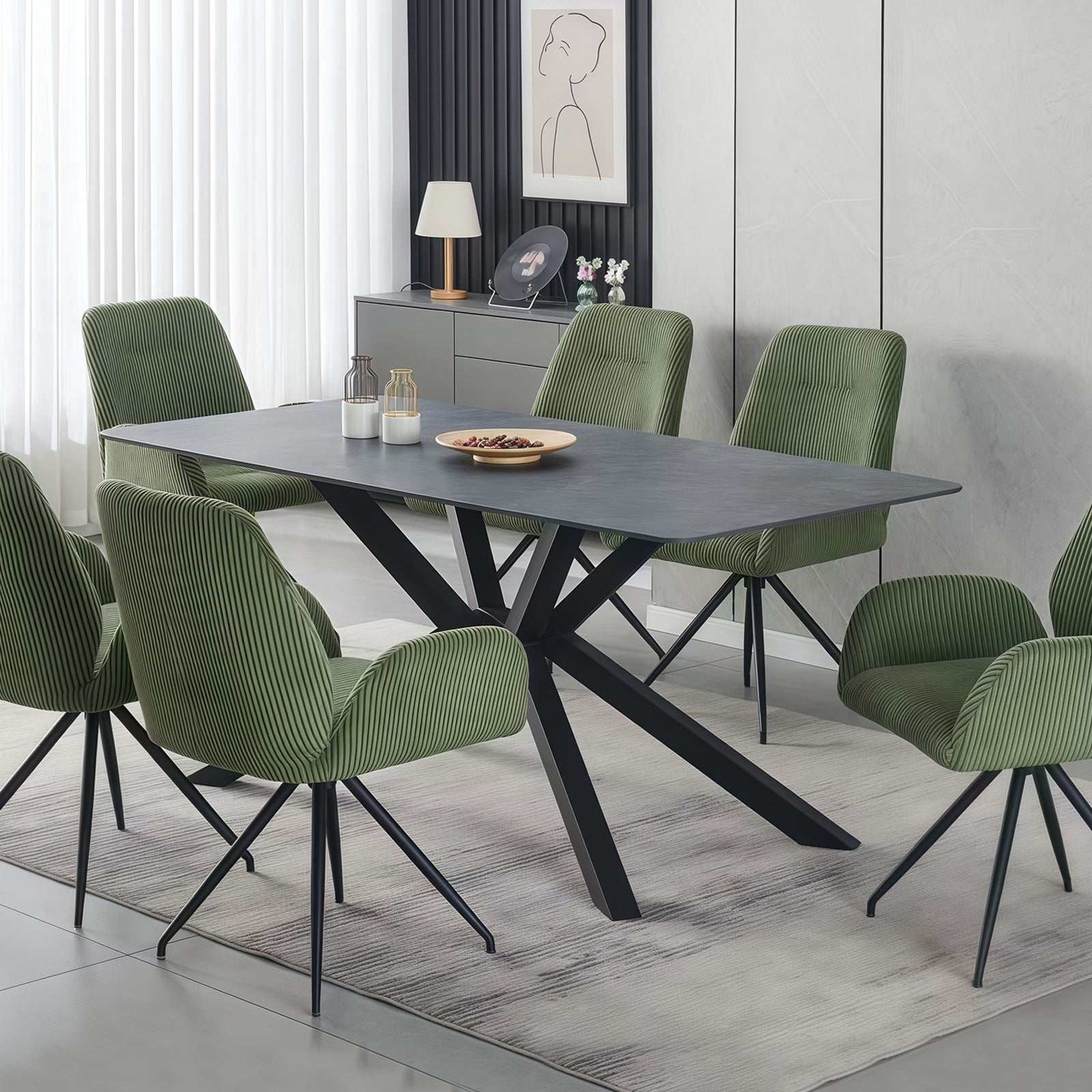 Rectangular dining table with green sintered stone top and powder-coated iron legs in modern setting.