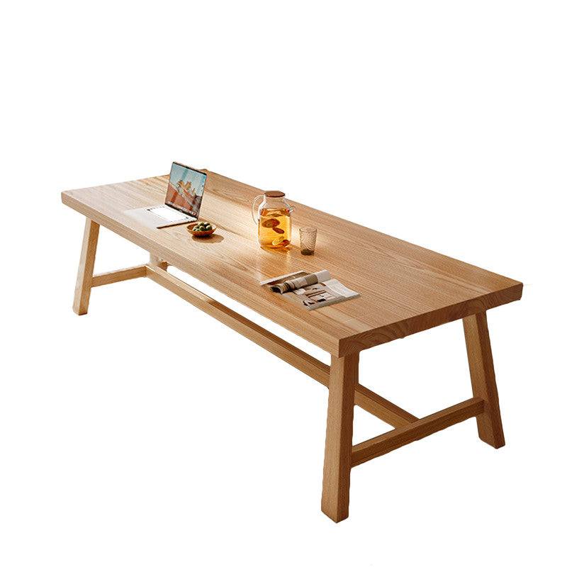 1.8M solid wood dining table with clear textured tabletop and stable triangular design.