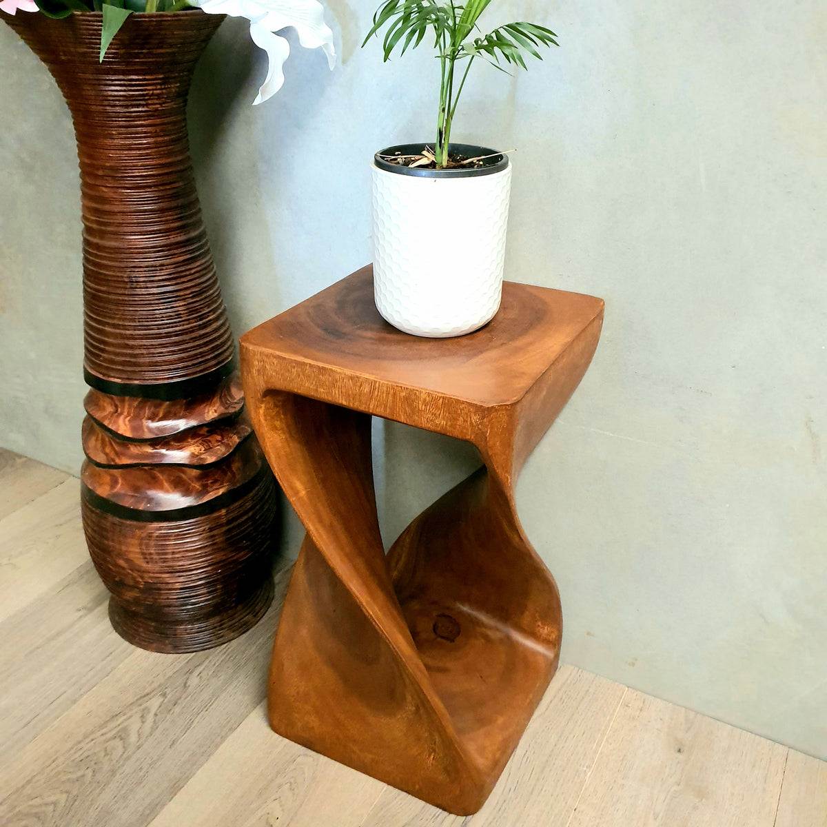 Twist Raintree Wood side table with twisted design, handcrafted from solid wood, ideal as corner or lamp table.