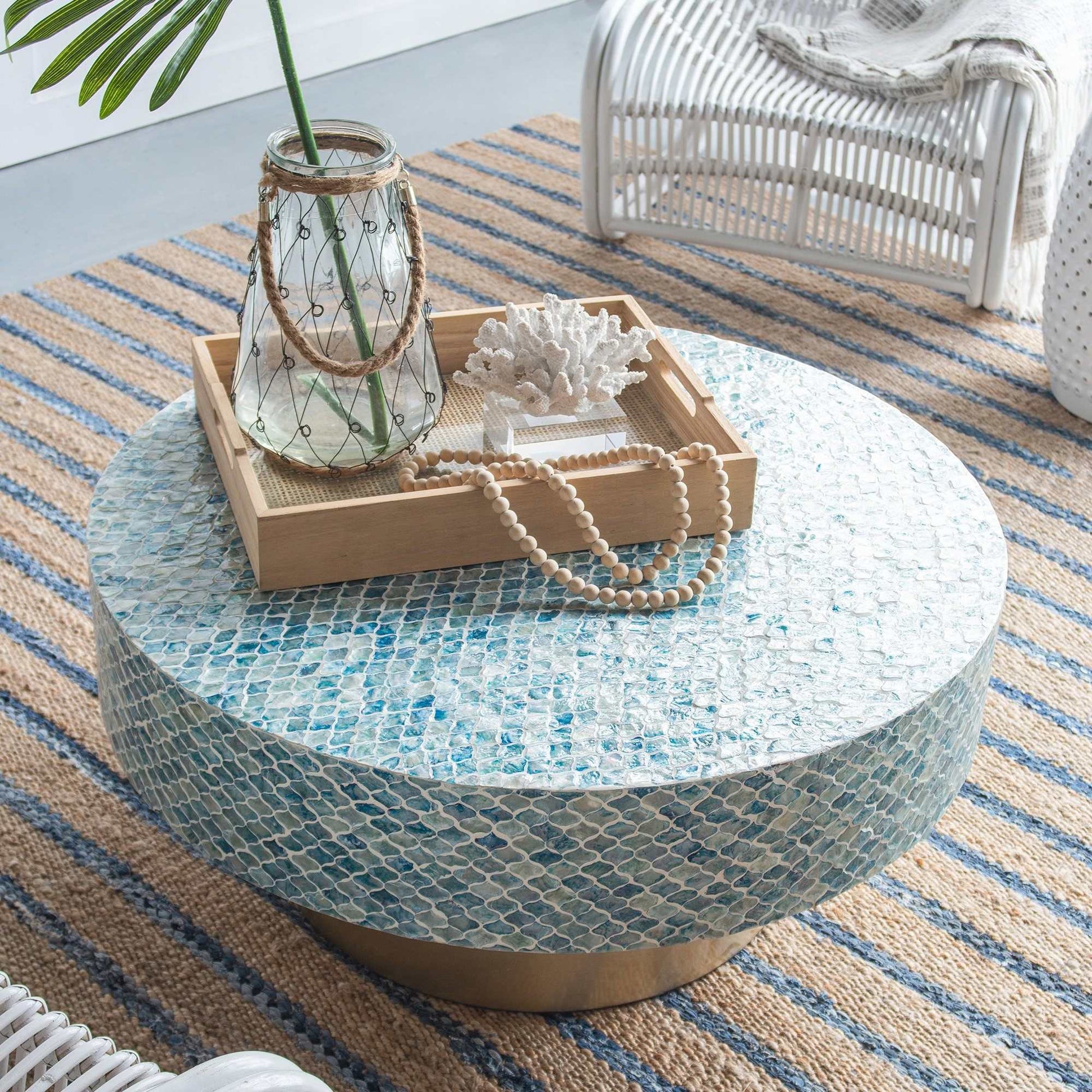 Round Goa Shell Coffee Table with blue-hued shell design on white background, handmade in Vietnam.