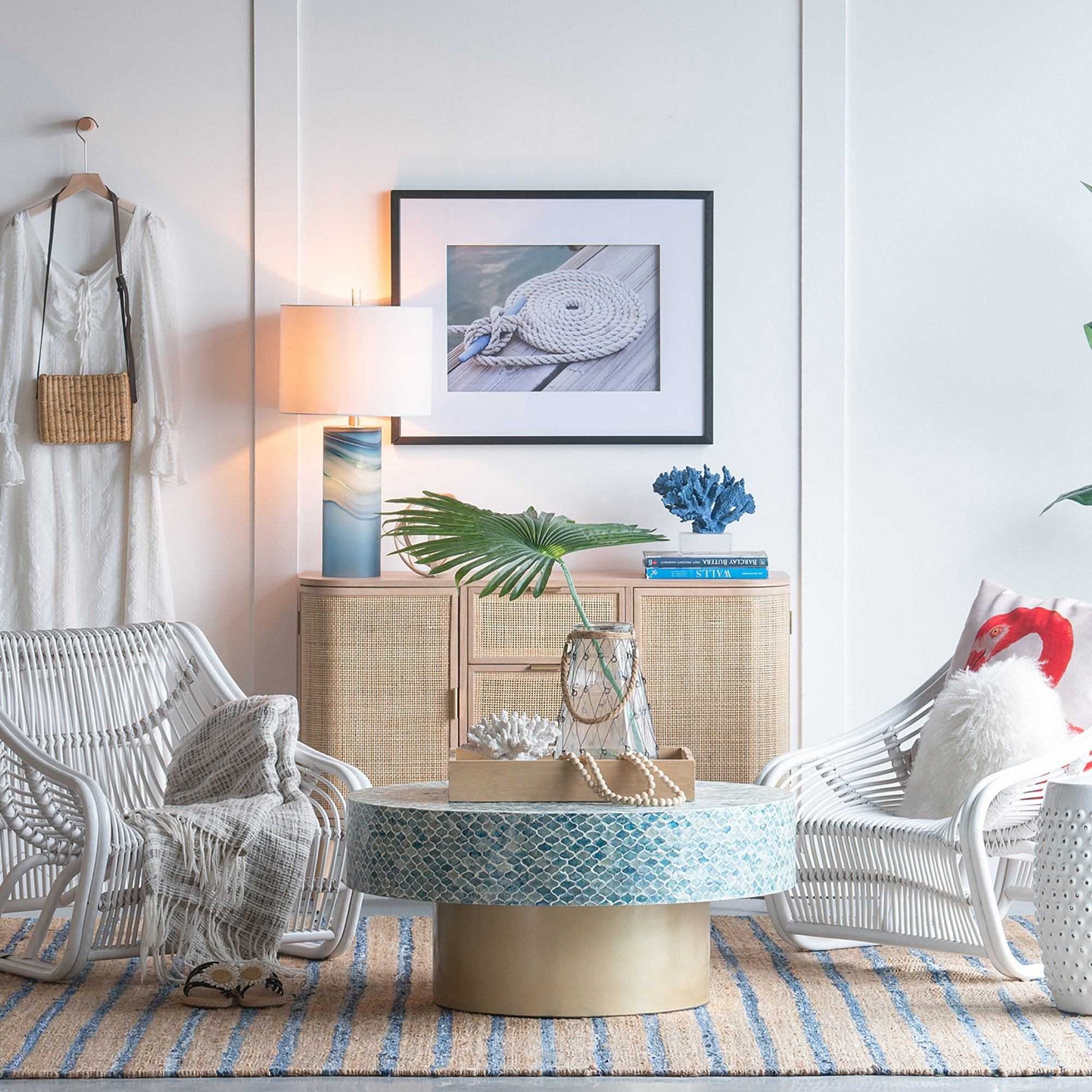 GOA SHELL COFFEE TABLE with blue shell pieces in a cozy coastal-themed living room setting.