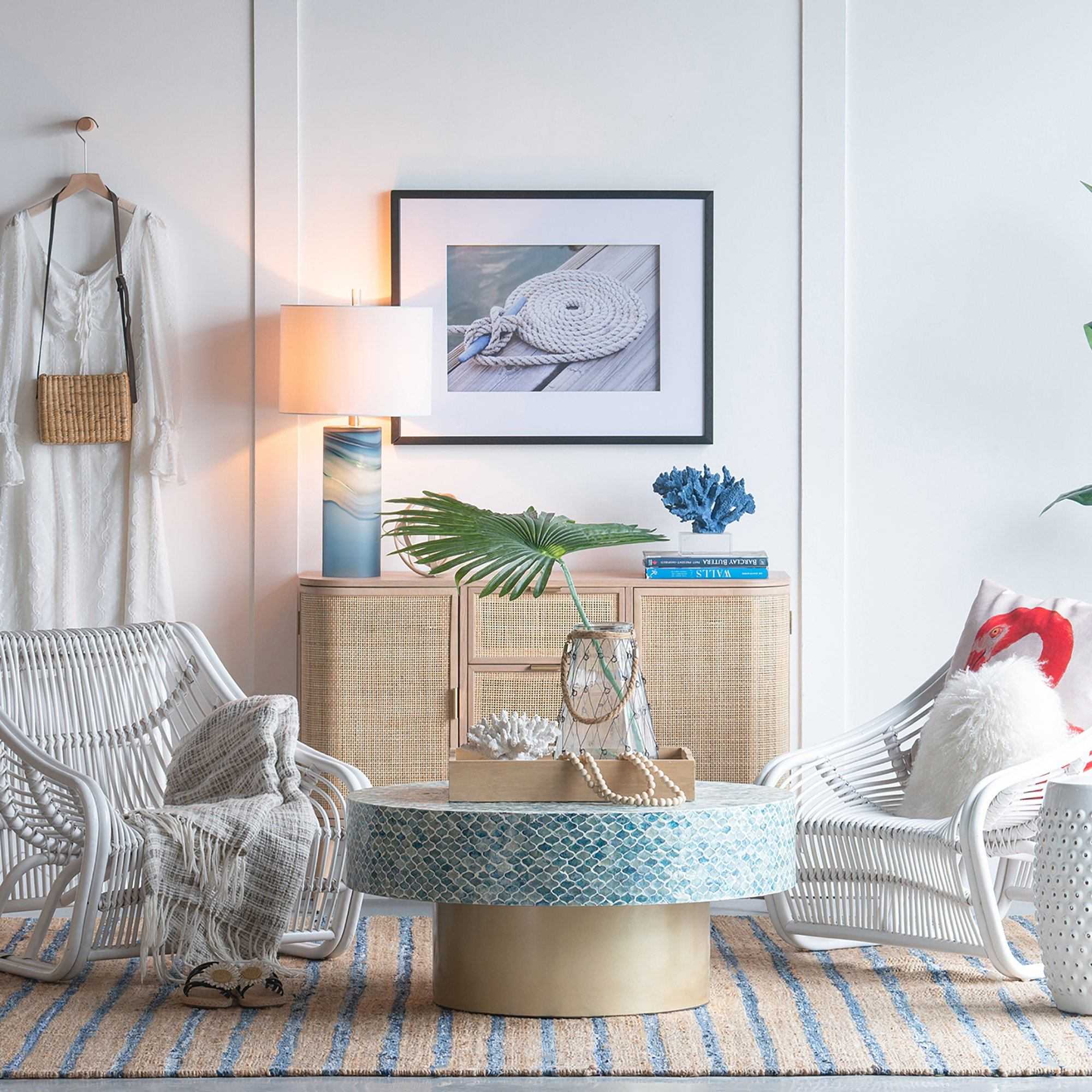 GOA SHELL COFFEE TABLE with blue shell pieces in a cozy coastal-themed living room setting.