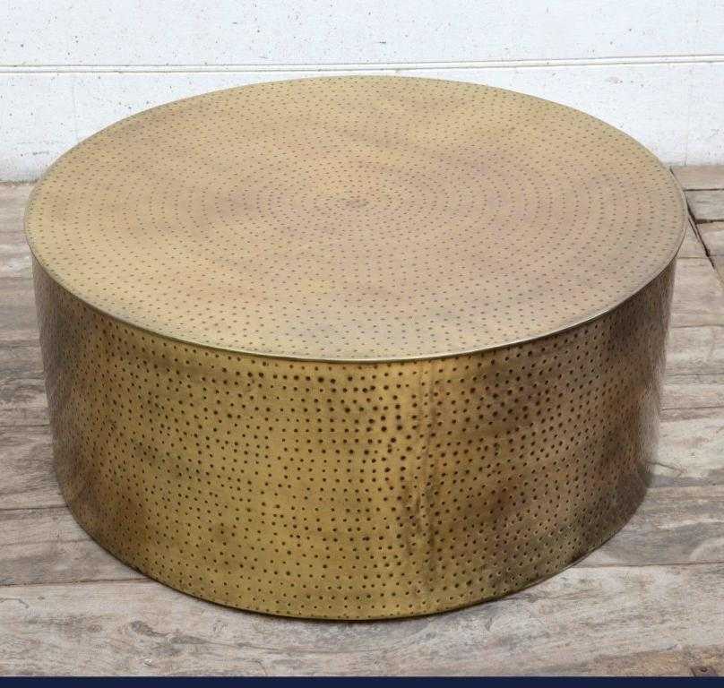 Hammered coffee table with matte metallic finish, hand forged iron, rustic design.