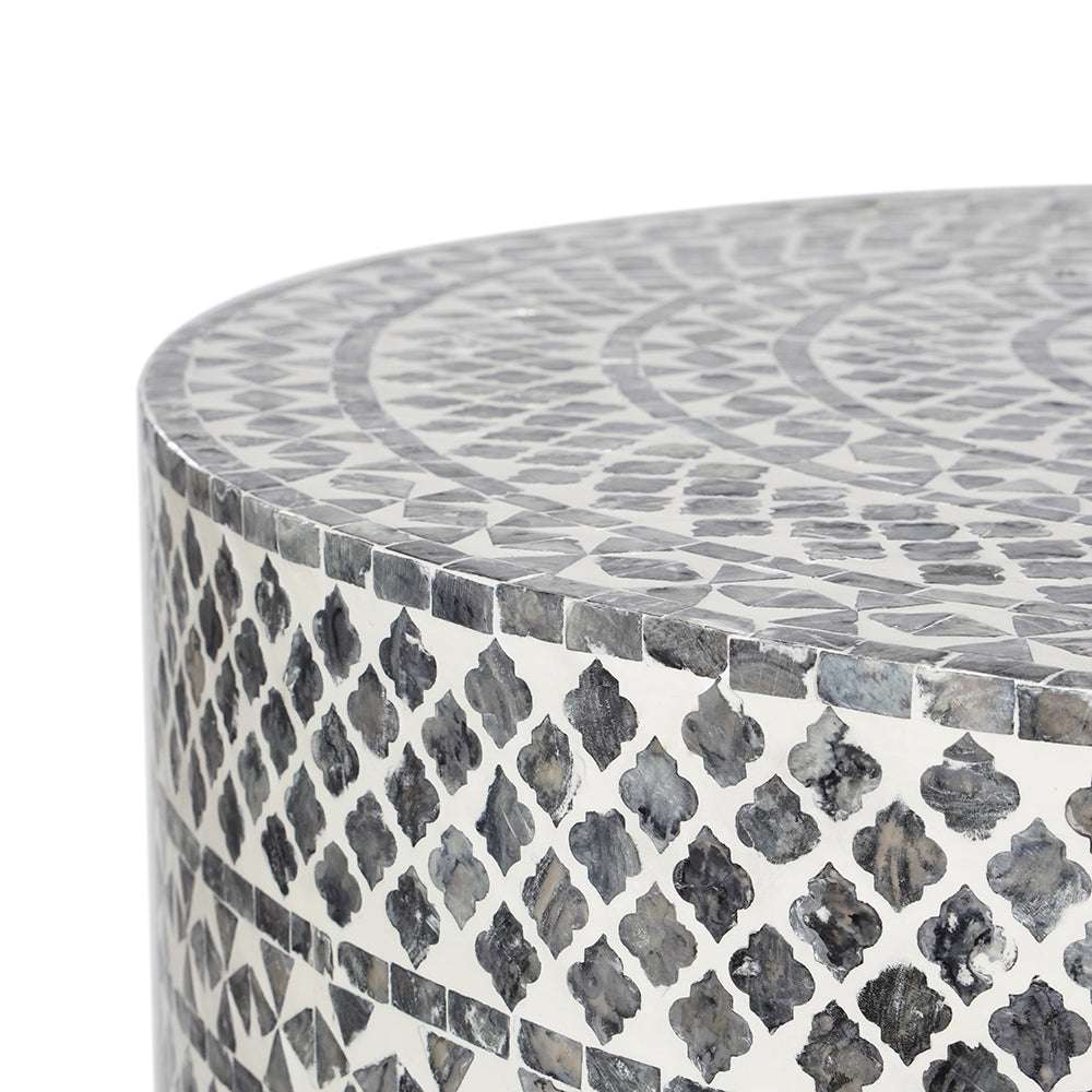 Black diamond patterned mother of pearl coffee table with seashell embellishments.