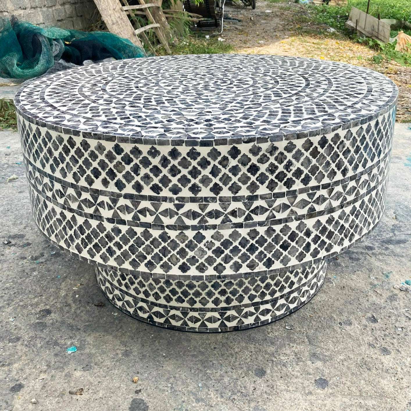 Black diamond patterned coffee table made with Mother of Pearl and seashells.